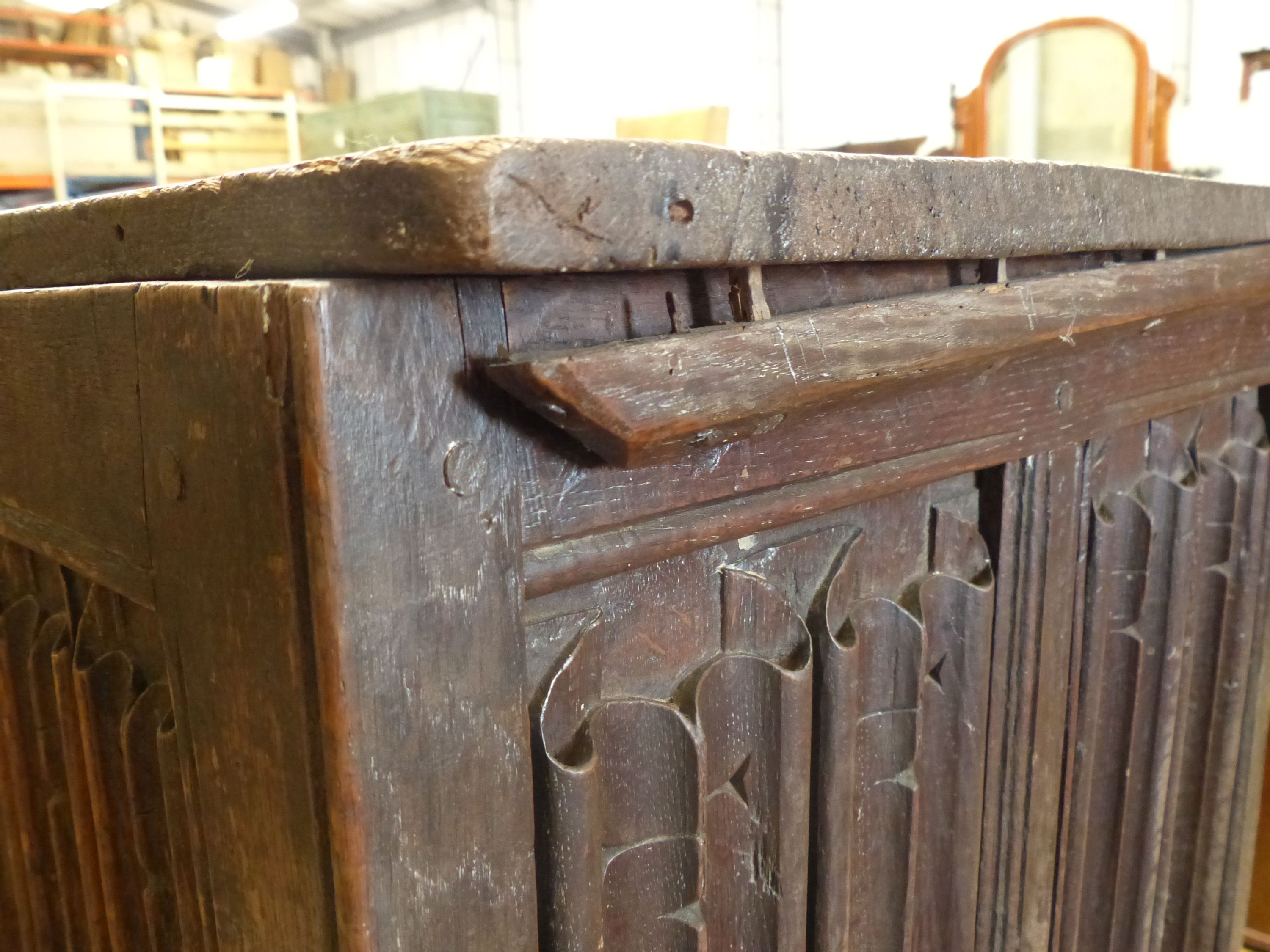 A carved and panelled oak chest, length 129cm, depth 51cm, height 63cm